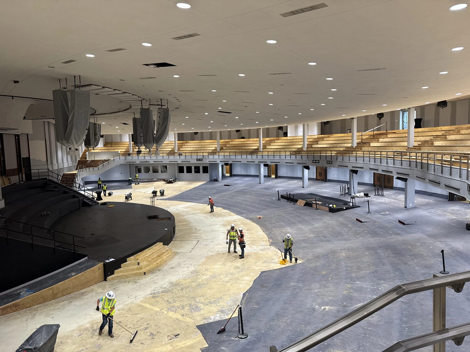 Crews on the auditorium floor at BRAVE Church during the LED lighting retrofit, Cherry Hills Village Colorado
