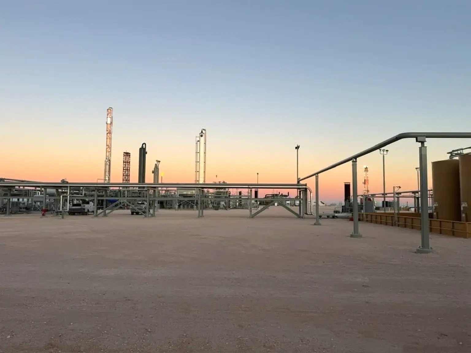 Large industrial electrical facility at dusk